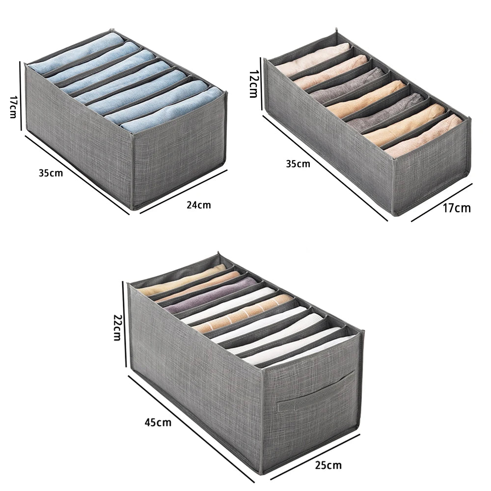 A gray foldable fabric closet organizer with handles showing various folded fabric items inside.