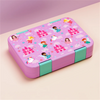 A pink portable kids lunch box with divided compartments featuring colorful princess and fairy designs.