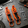 Two orange heavy-duty quick release shovel holders for roof rack or wall displayed on a dark surface.