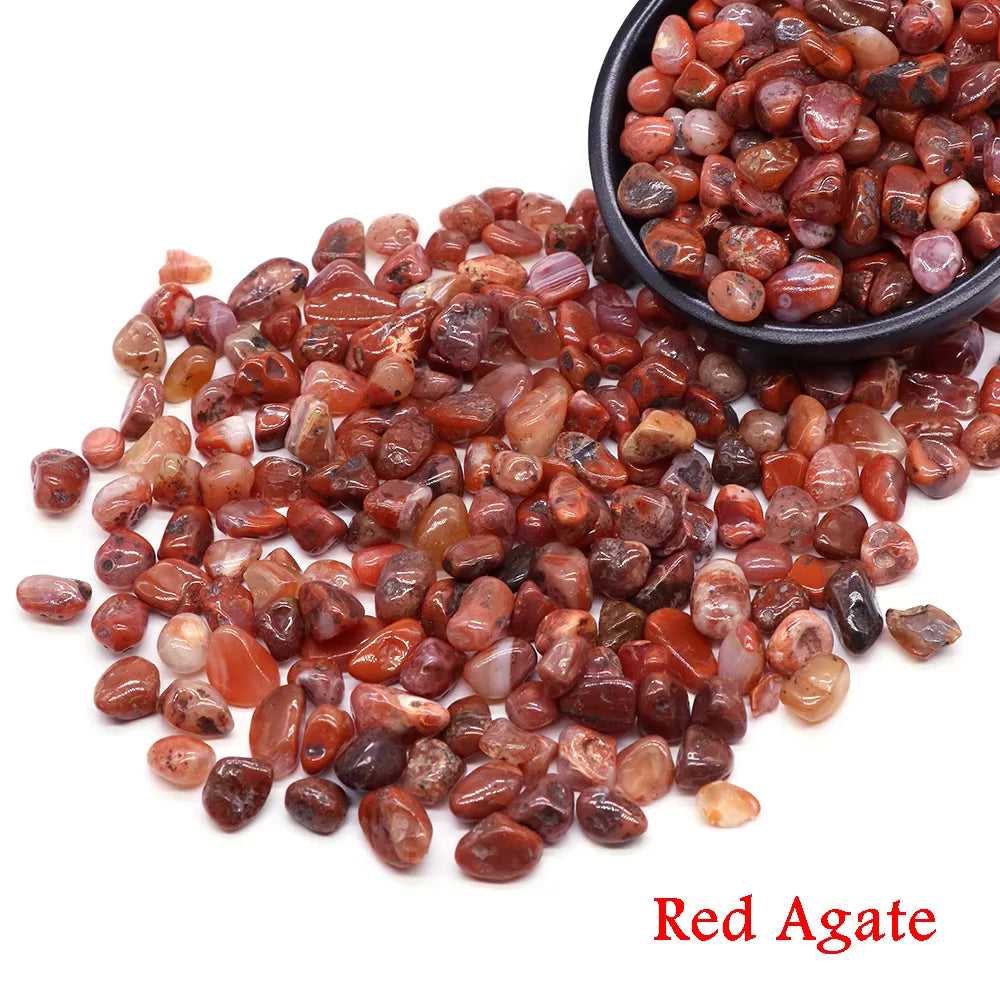 A pile of reddish-brown tumbled agate crystal stone chips.