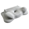 A gray butterfly contour memory foam pillow is shown from above, highlighting its soft, sculpted shape.