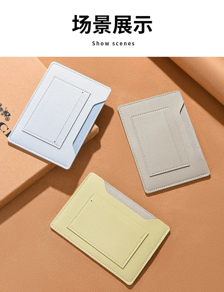 Three ultra-thin passport holders in light blue, beige, and pale yellow are displayed on a neutral background.