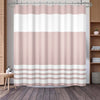 A beige and white striped waffle weave shower curtain hanging on a rod.