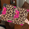A leopard print floral tablet case for an iPad featuring pink flowers and brown background.