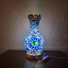 A handcrafted Turkish mosaic table lamp with a vibrant blue and multicolored LED glow.
