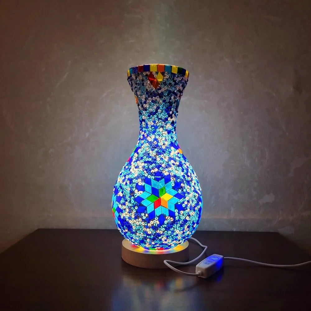 A handcrafted Turkish mosaic table lamp with a vibrant blue and multicolored LED glow.