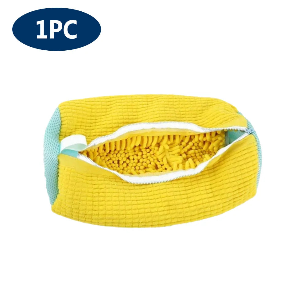 A yellow reusable mesh laundry bag for shoes, showing the open interior and white trim.