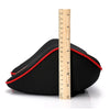 Black memory foam car headrest pillow with a red trim shown next to a ruler for scale.
