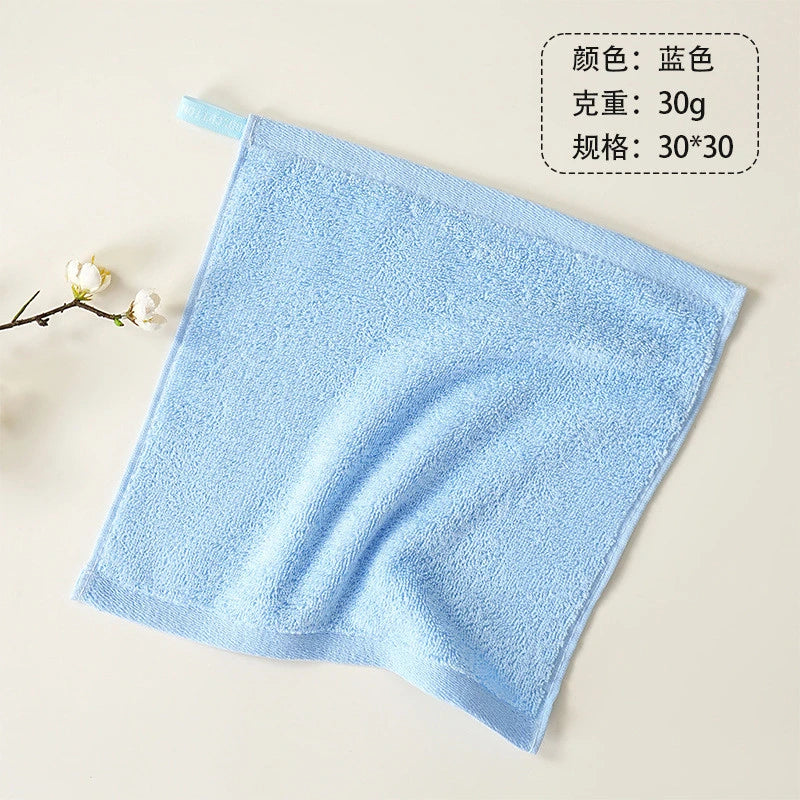 Light blue microfiber face towel folded and displayed on a neutral background.