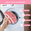 A hand is shown inserting a pink reusable microfiber mop pad into the cleaning compartment of a white washing machine.