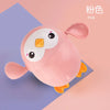 A pink wind-up bath toy featuring cartoon sea creatures like turtles, ducks, and whales.