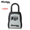 A black portable combination key safe with a silver body and a black handle, featuring a keypad.