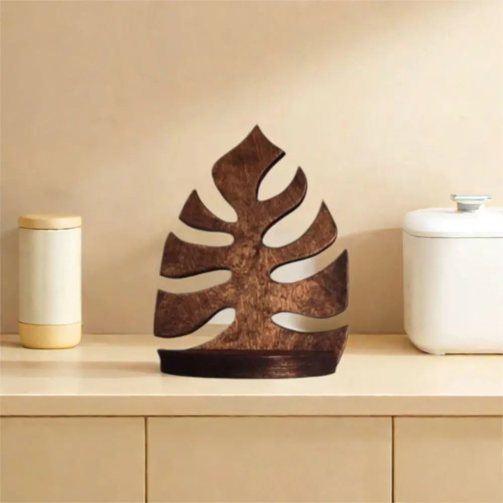 A rustic wooden wall-mounted storage rack with plant decor sits on a light wood shelf.