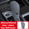 Grey silicone gear shift cover for automatic transmission visible in a car interior
