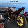 A black motorcycle is shown with heavy duty retractable ratchet straps used for securing the vehicle.