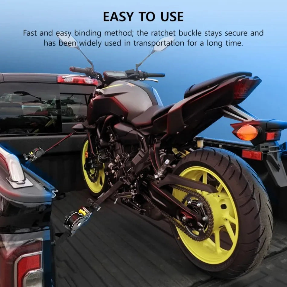 A black motorcycle is shown with heavy duty retractable ratchet straps used for securing the vehicle.