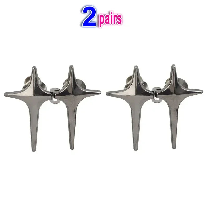 A pair of silver Y2K star waist tightener clips for jeans.