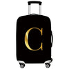 Black rolling suitcase with a gold letter C print and a black handle.