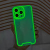 A hand holds a glow-in-the-dark neon green clear phone case for an iPhone, showing the camera module.