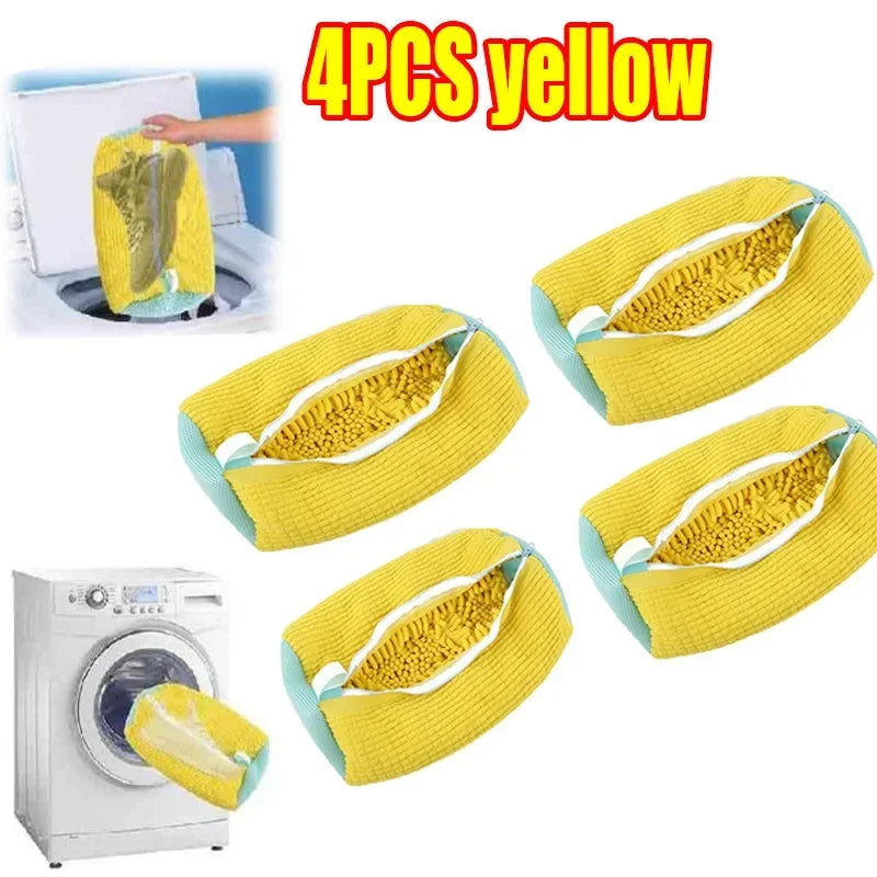 Four yellow reusable shoe washing bags shown next to a washing machine.