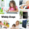 A young girl is using an LCD writing tablet for drawing and writing on a white surface.