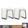 Two stainless steel sponge holders with attached stickers shown against a white background.