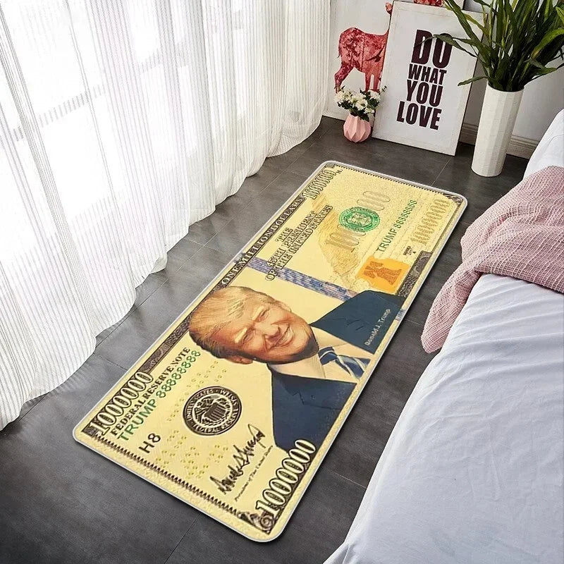 A yellow banknote pattern anti-slip soft floor mat lying on a dark floor next to a bed.