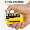 A hand holds a yellow keyless alarm disc lock device, demonstrating how to press down to lock it.