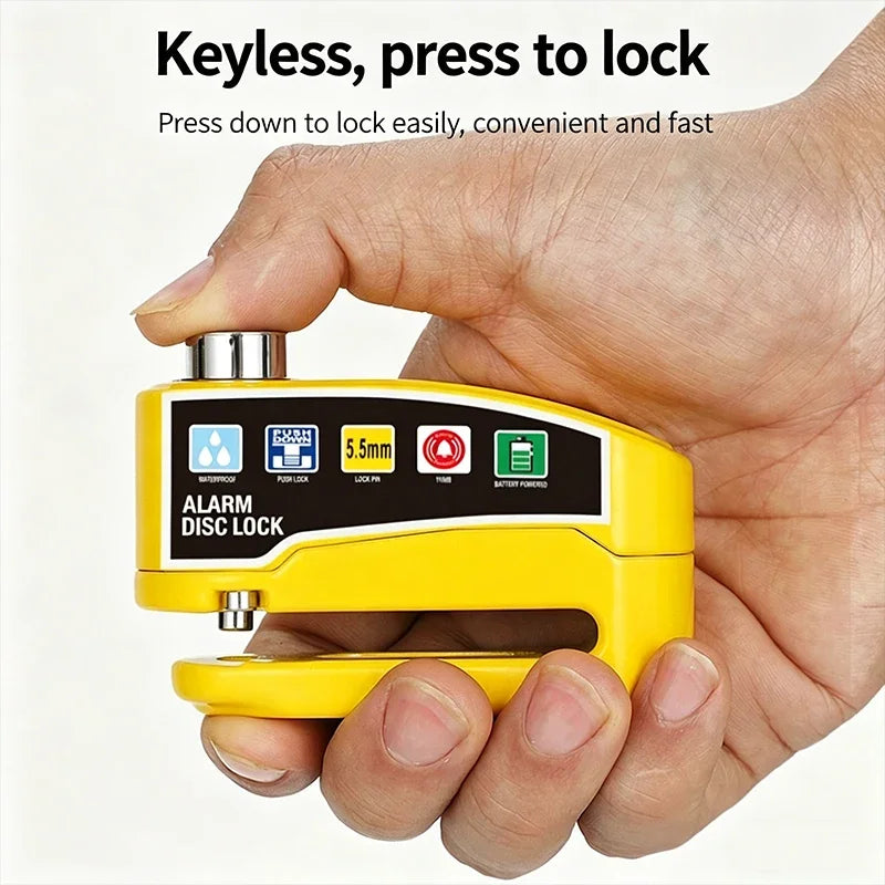 A hand holds a yellow keyless alarm disc lock device, demonstrating how to press down to lock it.