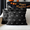 Black faux fur throw pillow cover with white ghost pattern displayed on a white sofa.