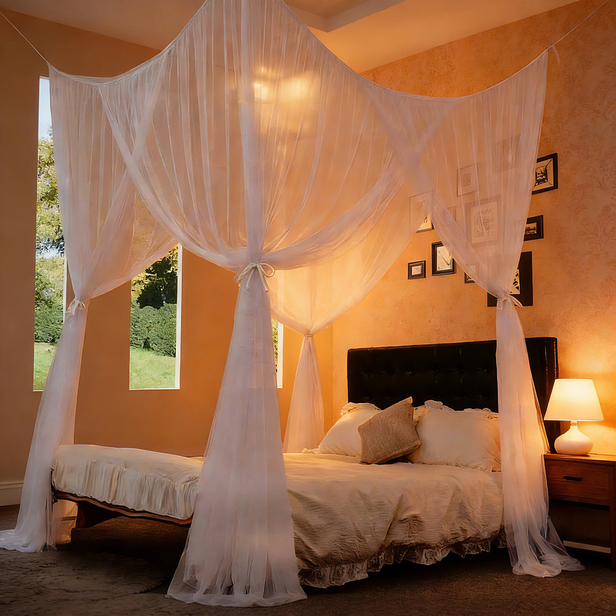 A bedroom featuring an elegant white mosquito net bed canopy draped over a bed, with warm lighting and framed pictures on the