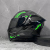 A black modular flip-up motorcycle helmet with bright green accents is displayed against a gray background.