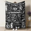 A black throw blanket featuring retro skull and clown horror art with text like greed 59 and suicideboy