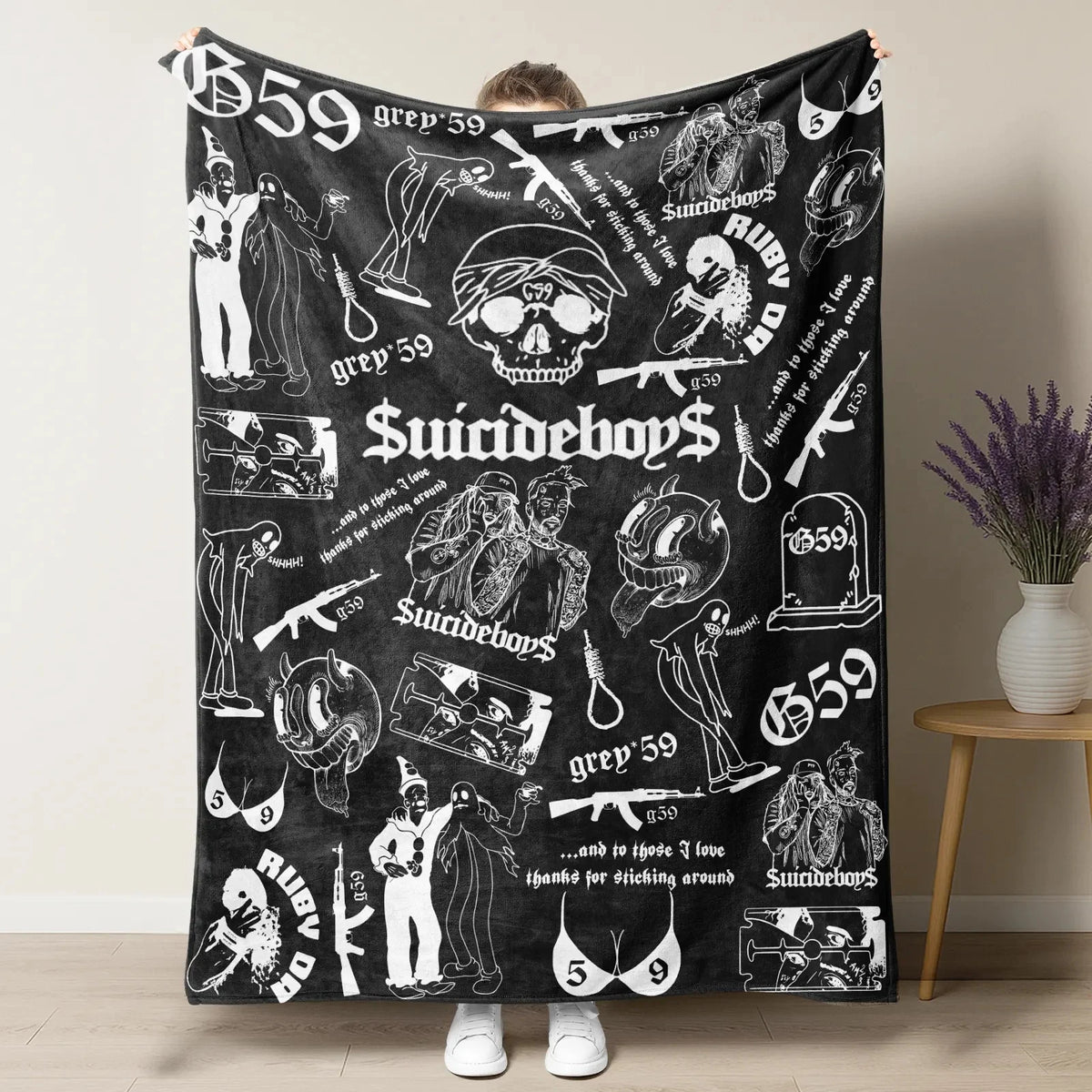 A black throw blanket featuring retro skull and clown horror art with text like greed 59 and suicideboy