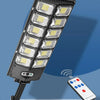 A close-up view of a high-power intelligent induction solar street lamp with an integrated remote control and LED light array