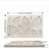 A white silicone mold with rose leaves for candle making and crafting, shown next to a flat version.