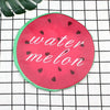 A bright pink watermelon fruit design on a green background, featuring the words water melon.