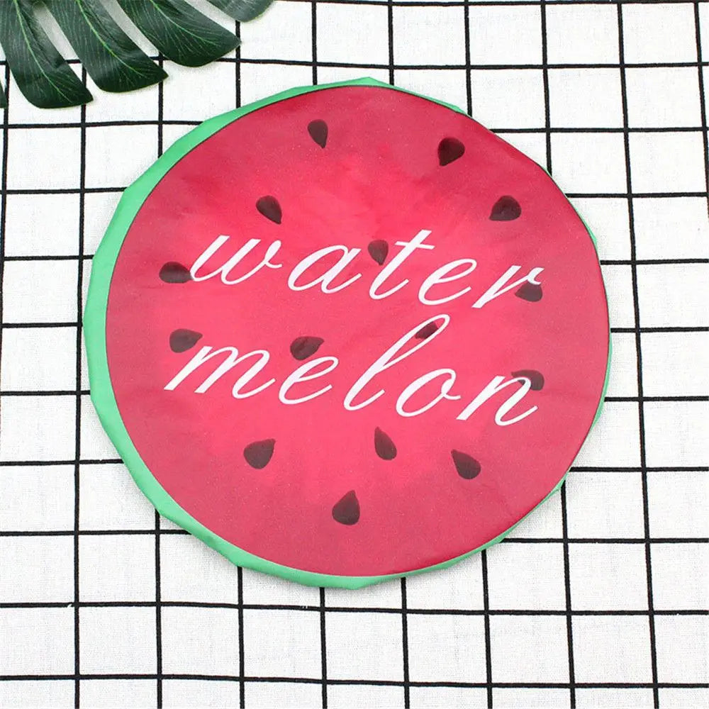 A bright pink watermelon fruit design on a green background, featuring the words water melon.