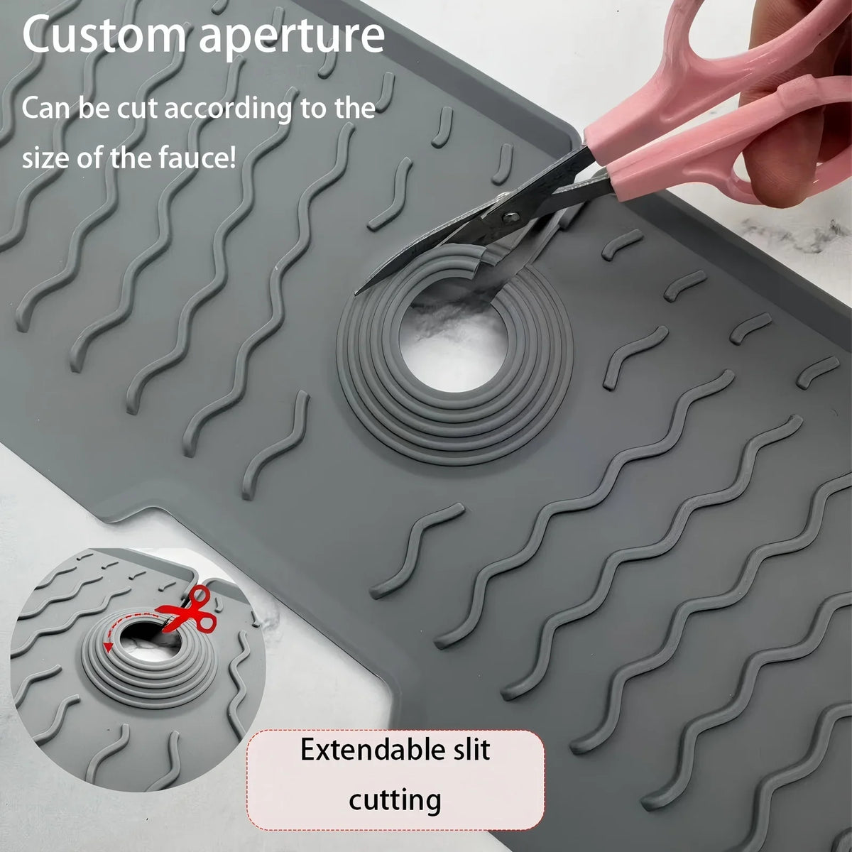 A silicone faucet mat with a custom aperture being cut by scissors to fit a faucet.