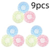 Nine reusable polka dot waterproof shower caps scattered on a white background.