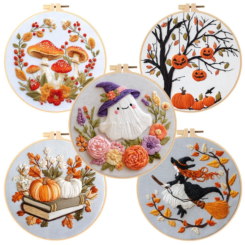 A collection of cross stitch kits featuring seasonal themes like pumpkins, autumn foliage, and witches.