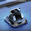 A black anti-slip dashboard phone mount with a silicone base and automatic snap-locking mechanism shown on a dark surface.