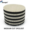 A set of five medium cut car polishing wool pads with black and white stripes.