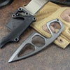 A compact stainless steel neck knife is shown next to a tan fabric and leather sheath.