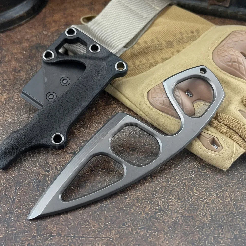 A compact stainless steel neck knife is shown next to a tan fabric and leather sheath.