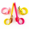 A set of pink and yellow silicone bands for a kids' dinosaur digital watch.