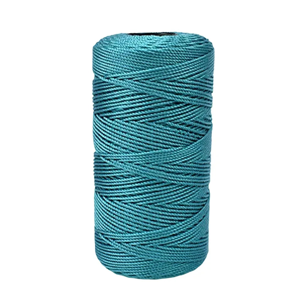 A spool of teal green ice cotton silk thread for knitting and crochet