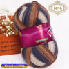 A ball of gradient dyed wool blend yarn with purple and blue stripes is shown on a white background.