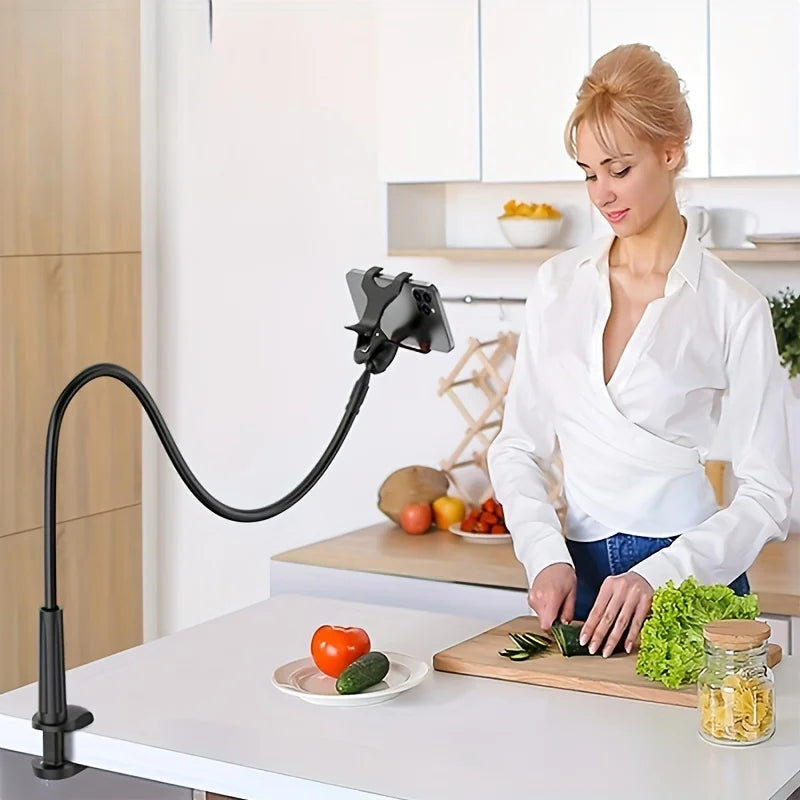 A woman is using a flexible gooseneck phone holder for bedside viewing on a kitchen table.