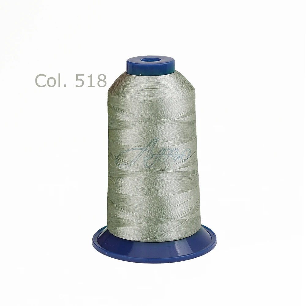 Spool of silver polyester embroidery thread labeled Col. 518